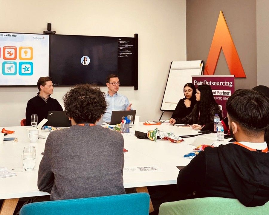 a group talking in a meeting room