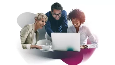 People huddled around a computer