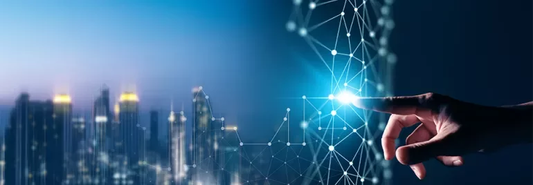 Hand touching digital interface with city skyline in background.
