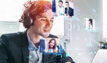 Person smiling with headphones, participating in a video call.