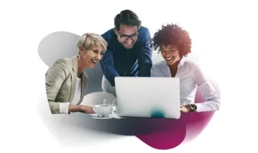People huddled around a computer
